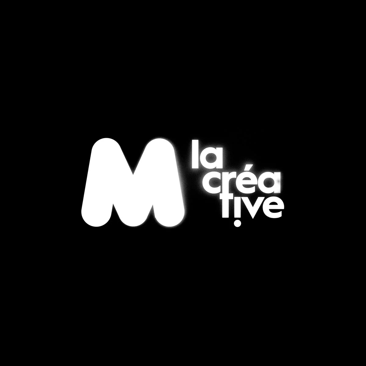 The M la Créative logo: white on black.