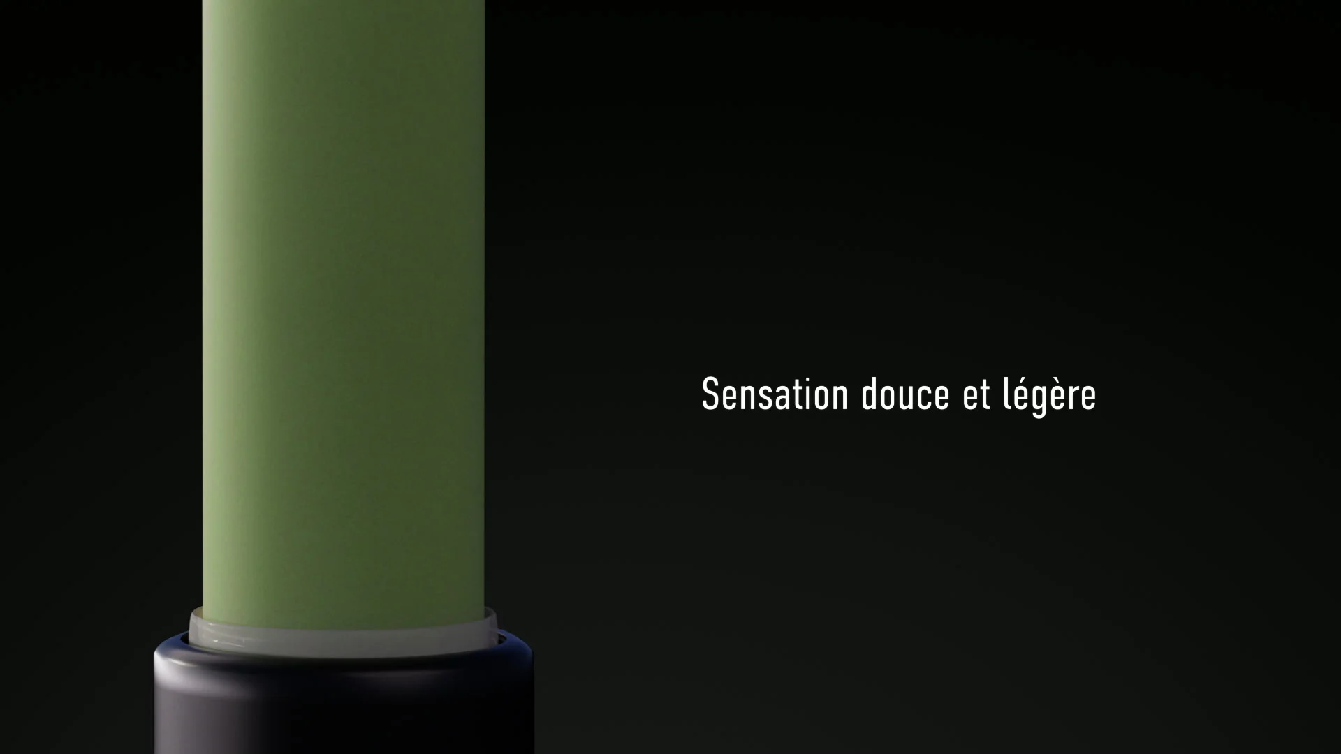 Close-up of the green balm, with French text meaning “A soft, light sensation” against a dark background.