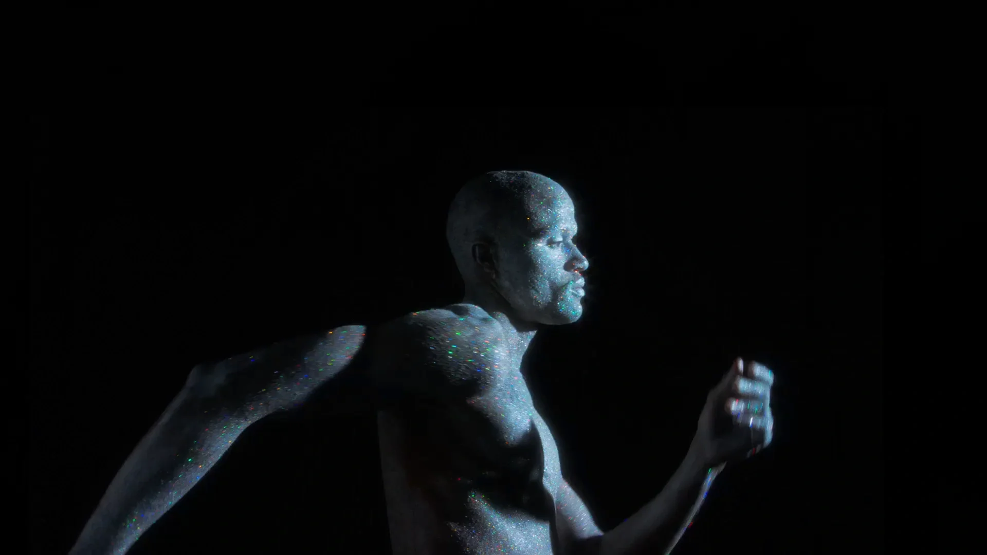 Running human figure made of glowing blue points against a black background.