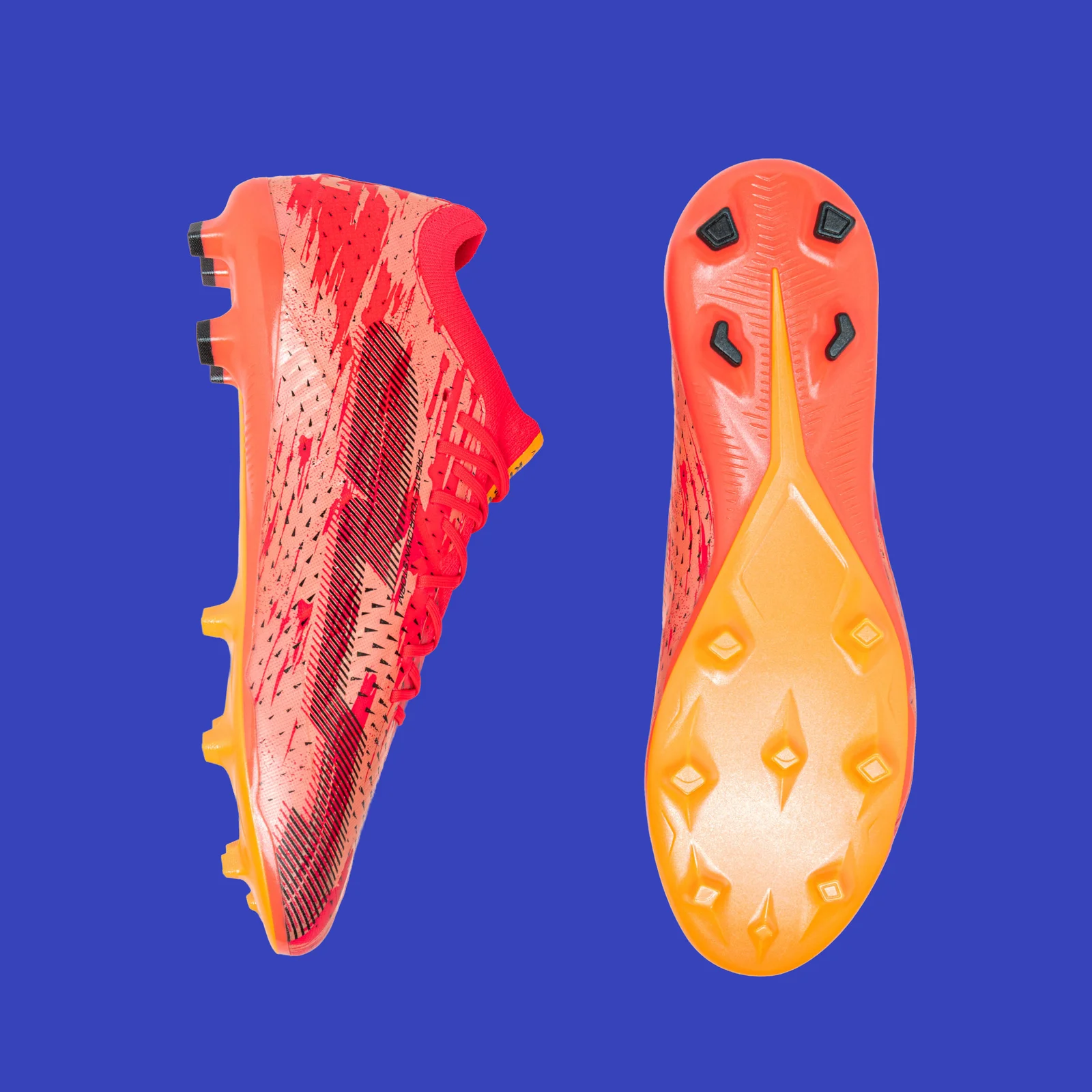 Pink Kipsta CLR Red Storm shown in profile and from below, with its orange outsole.