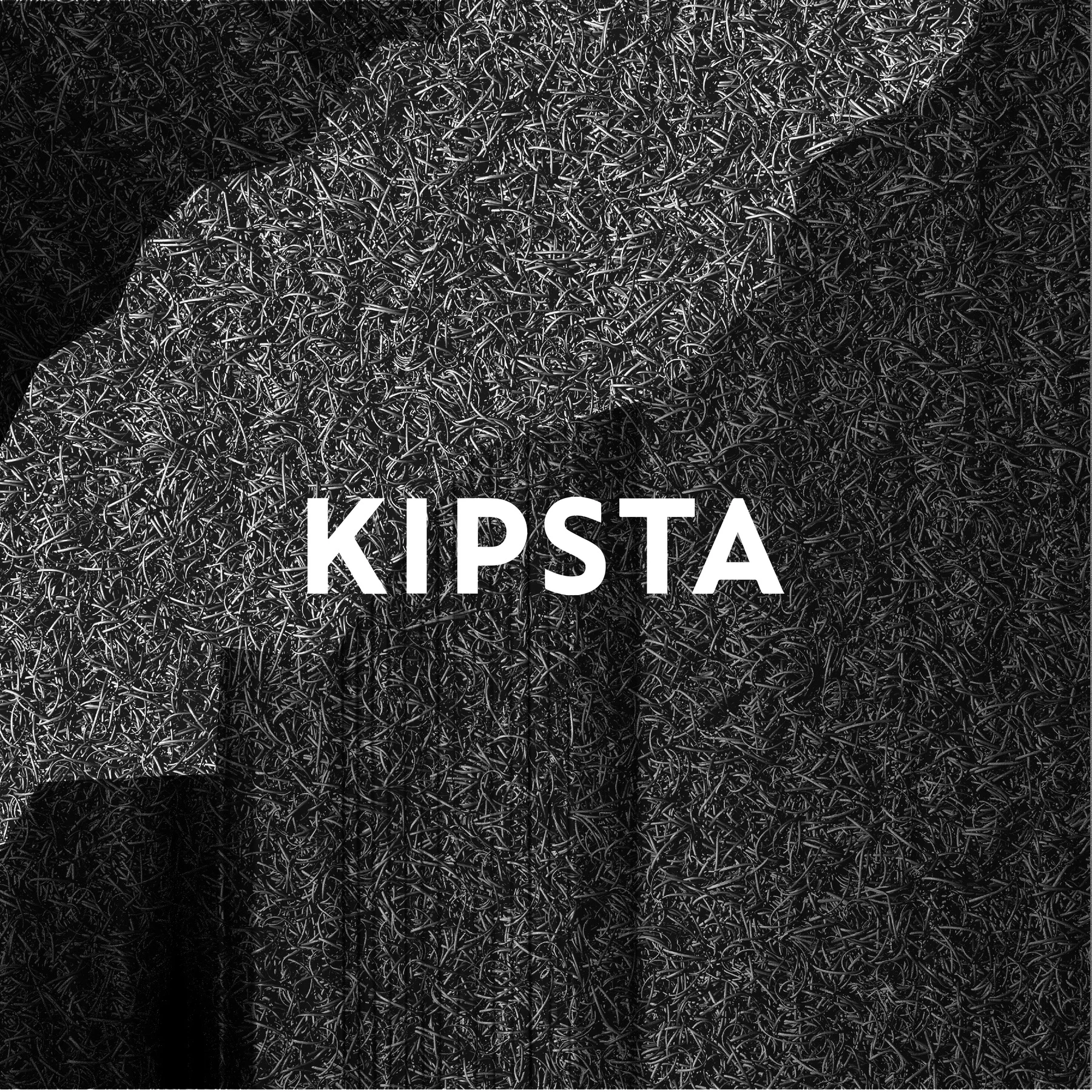 Kipsta logo and a torn grass edge.
