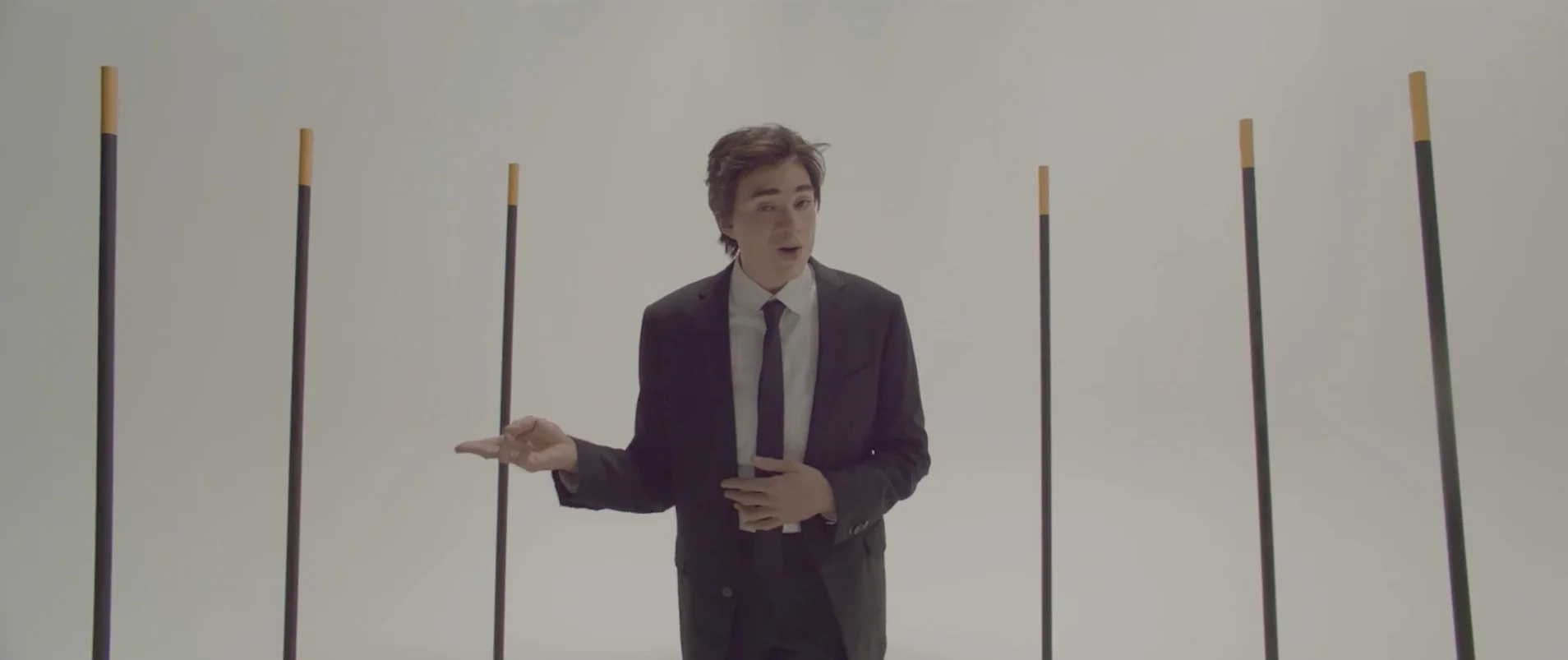 Reference frame: speaking between the vertical markers on the set.